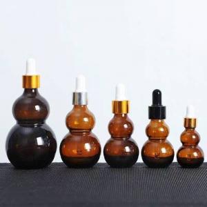Brown gourd shaped glass bottle with dropper