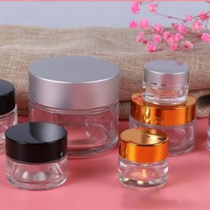 Round transparent cosmetic glass jar